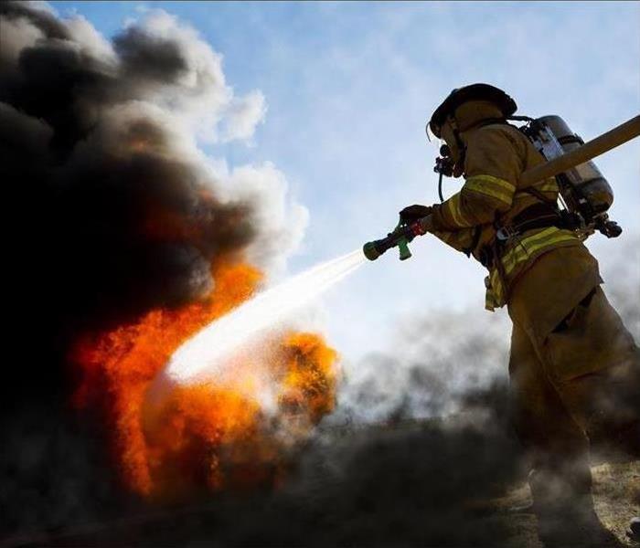 Firefighter putting out a fire